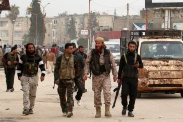 Des miliciens dans la ville d'Idleb