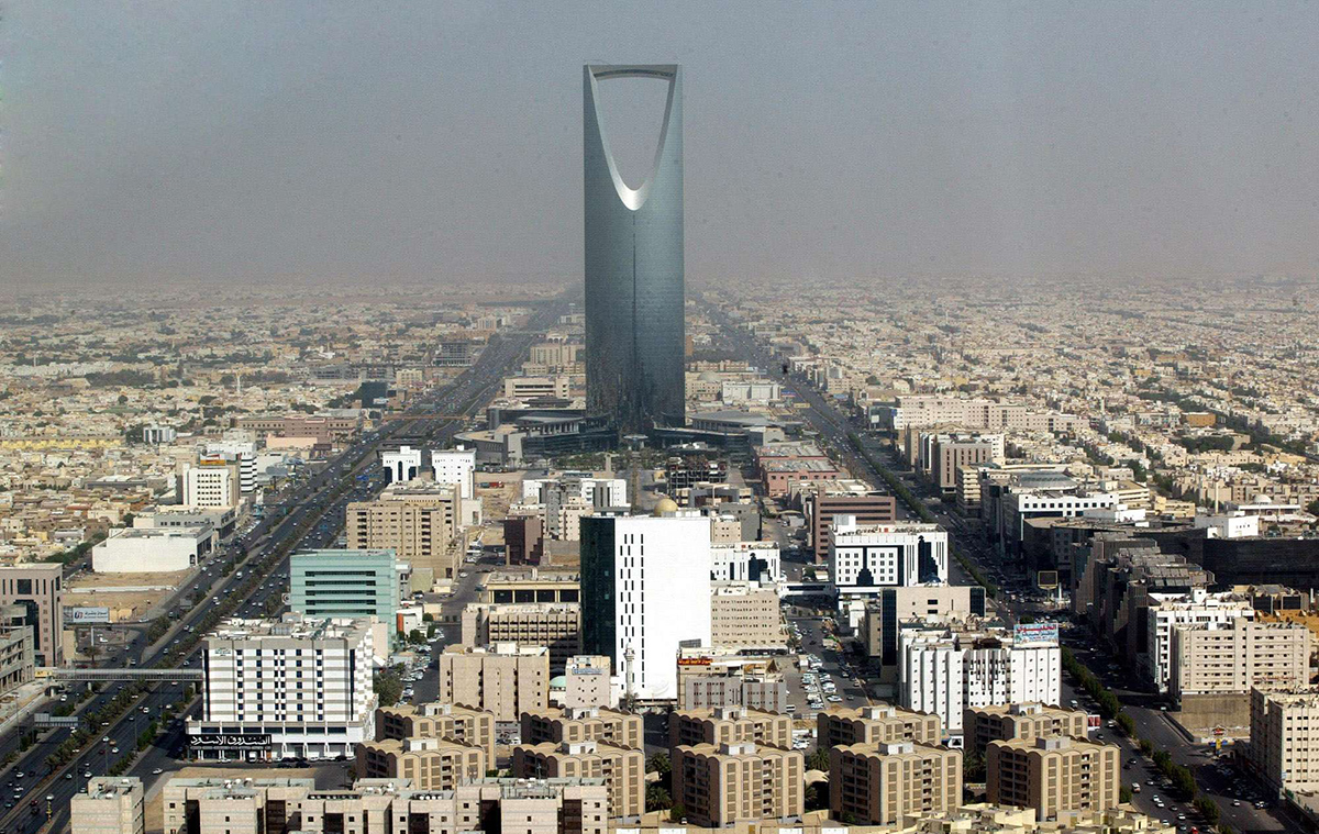 FILE- In this Monday, Oct. 6, 2003 file photo, Saudi Arabian capital Riyadh with the 'Kingdom Tower' photographed through a window of the 'Al-Faislia Tower' in the Saudi Arabian capital Riyadh. Saudi Arabia’s stock exchange has opened up to direct foreign investment for the first time. The decision to open up the Tadawul stock exchange on Monday comes at a crucial time for Saudi Arabia, whose revenue has taken a hit from the plunge in oil prices over the past year. The kingdom is the world’s largest exporter of crude. (AP Photo/Markus Schreiber, File)/SAU502/343332721314/A MONDAY, OCT. 6, 2003 FILE PHOTO/1506150946